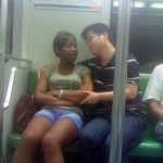 The picture is shot on the subway in South Africa; they are talking in Chinese language !.