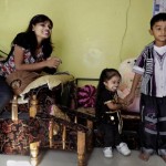 Jyoti holds the hand of her sister's five-year-old son Vishatej, as she prepares herself for the Guinness World Records ceremony