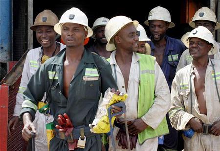 Zambian miners walk out of a lift at Konkola Copper mine in Chililabombwe, Zambia.